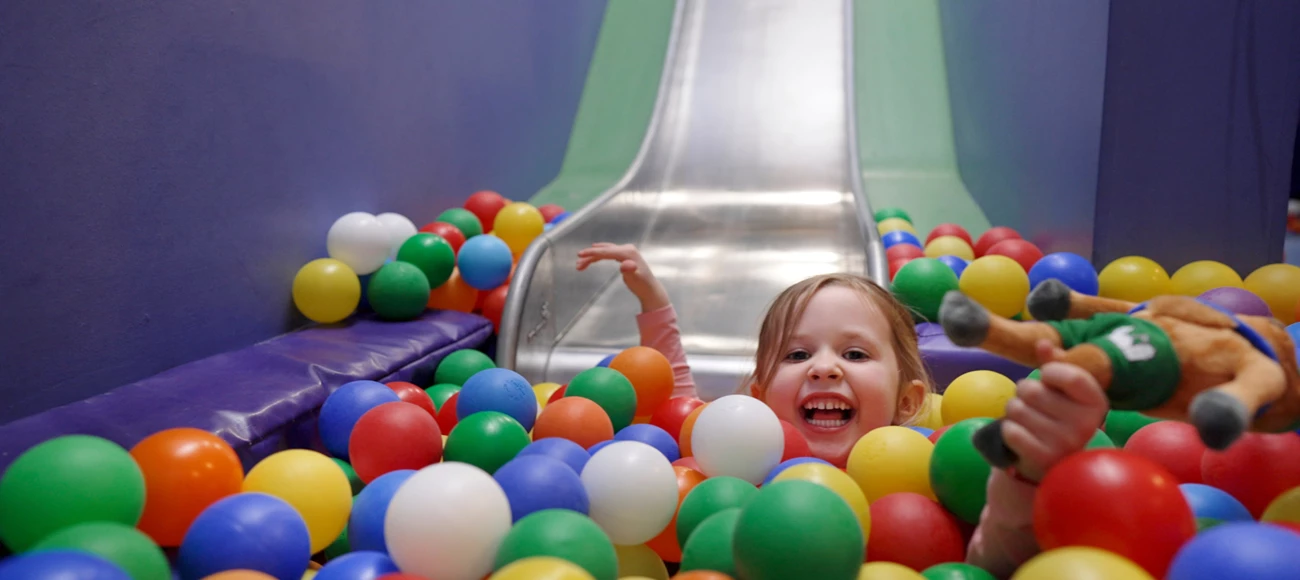 Toddler breaks kids in the ball pit