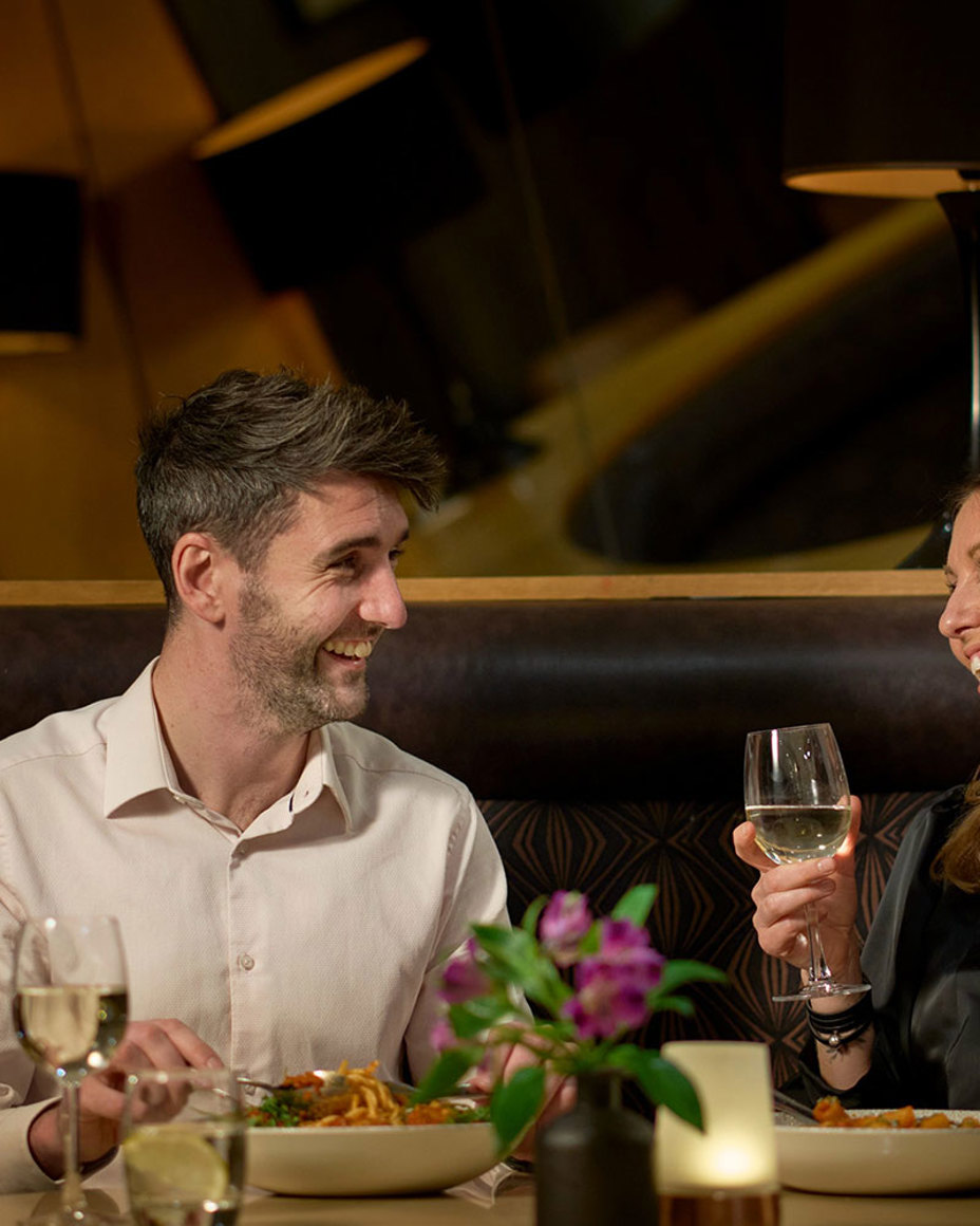 Couple enjoying drinks at a Crieff Hydro Family of Hotels location